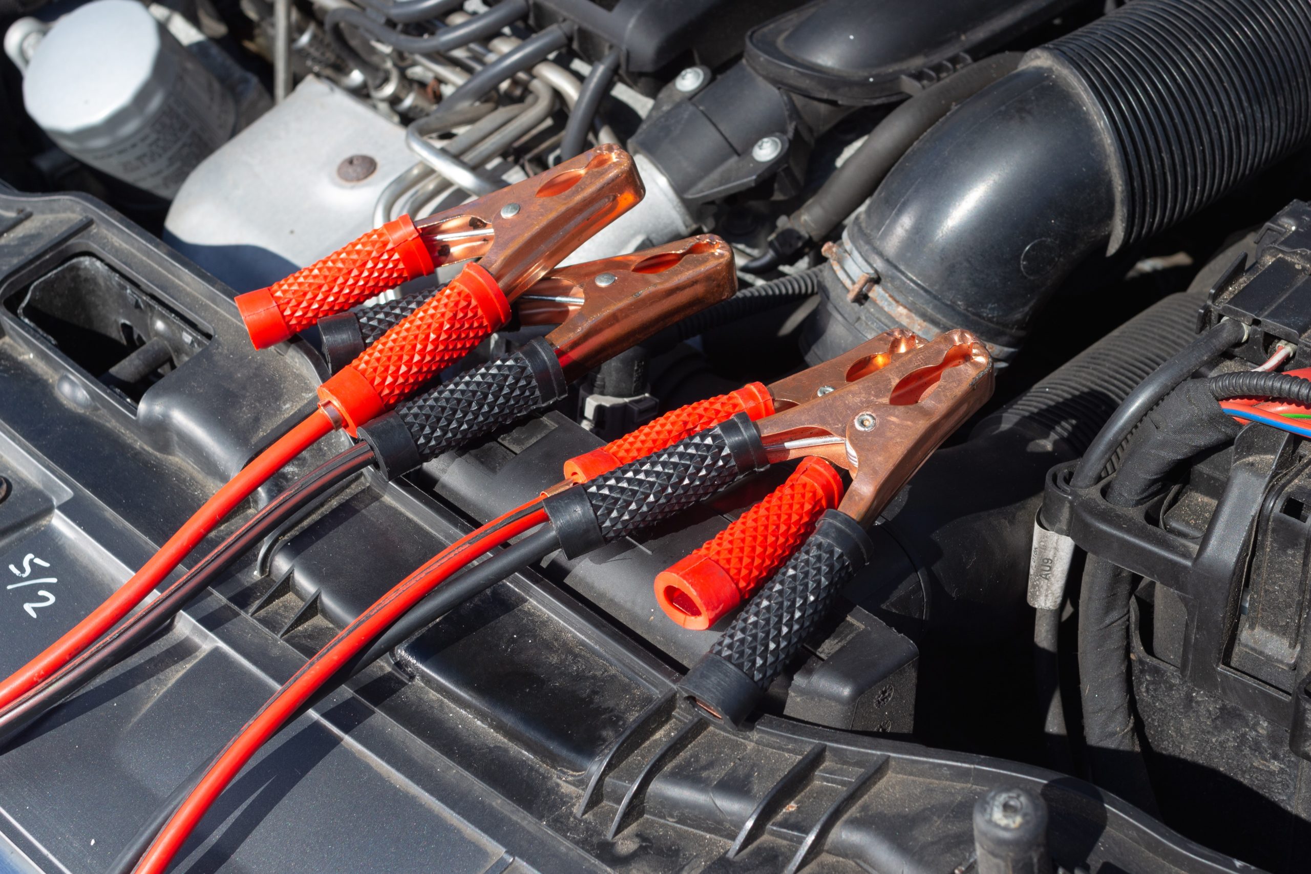 Electrical wiring attached to a car engine